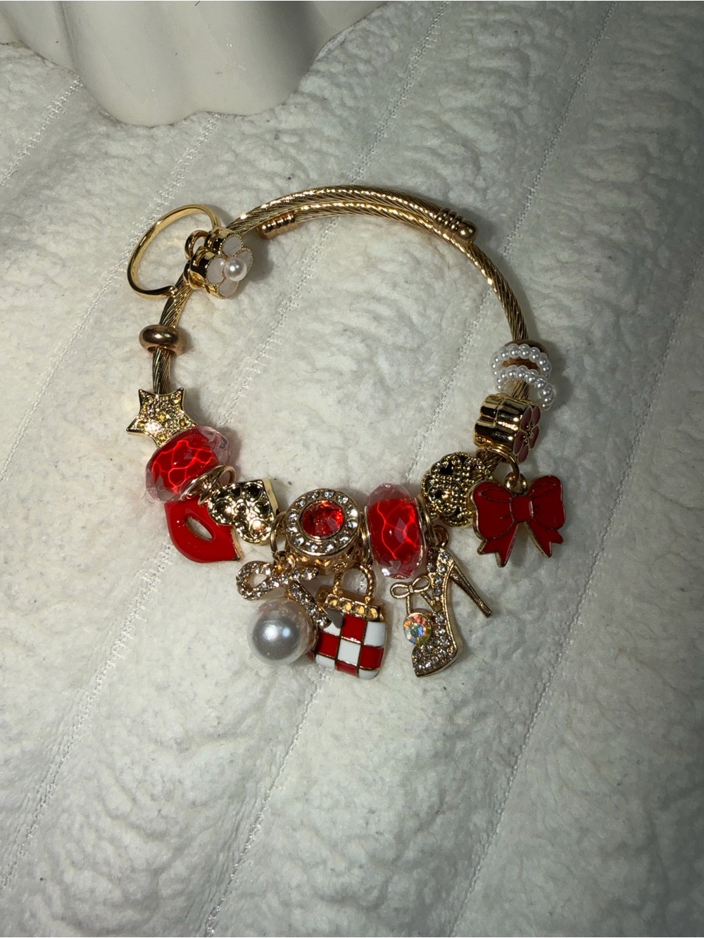 Gold Charm Bracelet with Red Accents and Charms